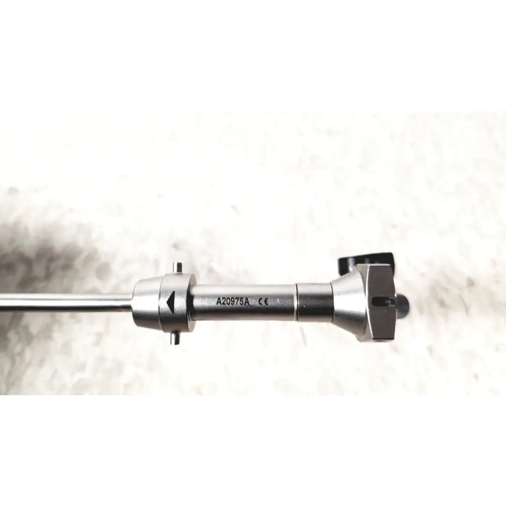 Silver surgical instrument with sleek metallic finish and engraved markings in olympus a20975a endoscope bridge a20975a