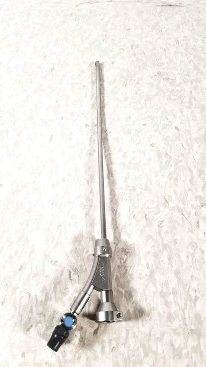Silver surgical instrument with a long slender shaft and y-shaped blue black handle for Olympus a20975a endoscope bridge
