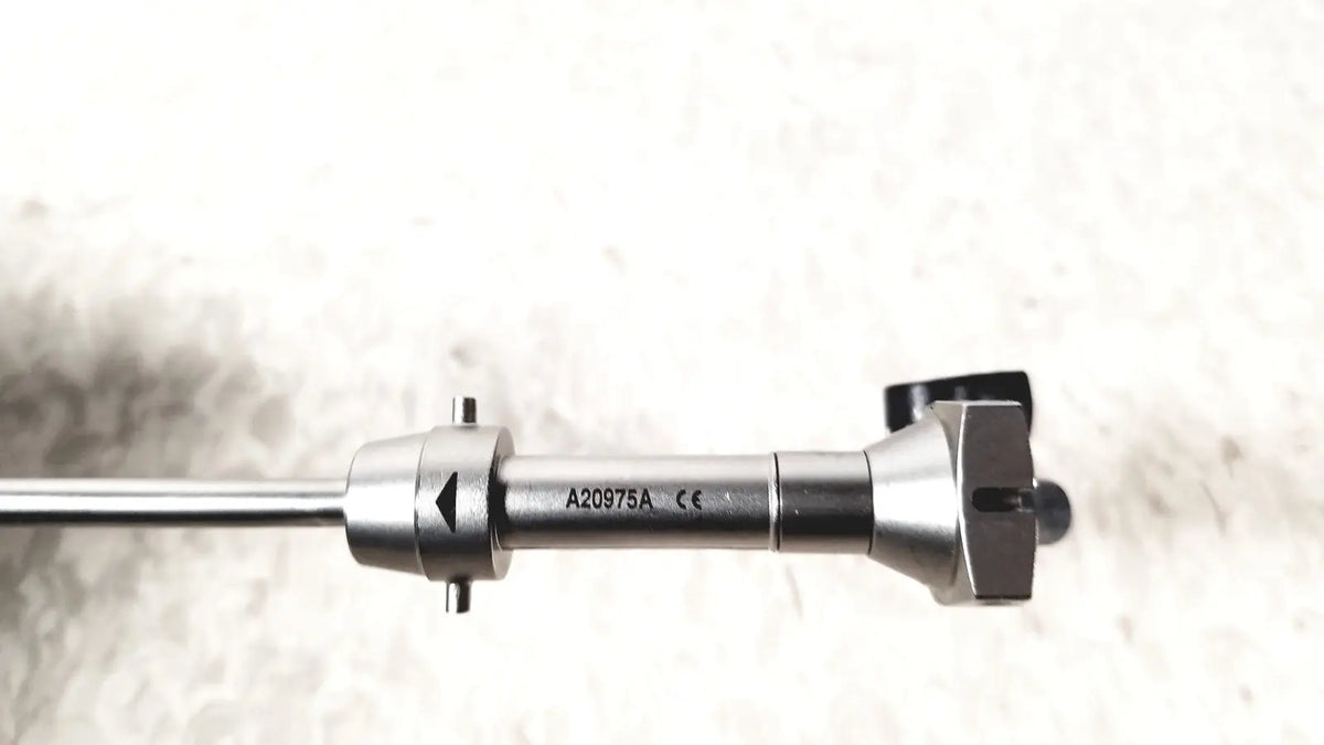 Silver surgical instrument with sleek metallic finish and engraved markings in olympus a20975a endoscope bridge a20975a