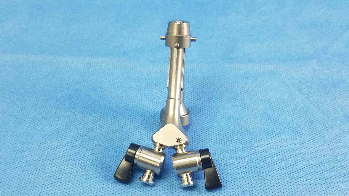 Silver surgical instrument with black ergonomic handles and central joint compatible olympus telescope cysto bridge dual channel