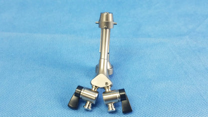 Silver surgical instrument with black ergonomic handles and central joint compatible olympus telescope cysto bridge dual channel