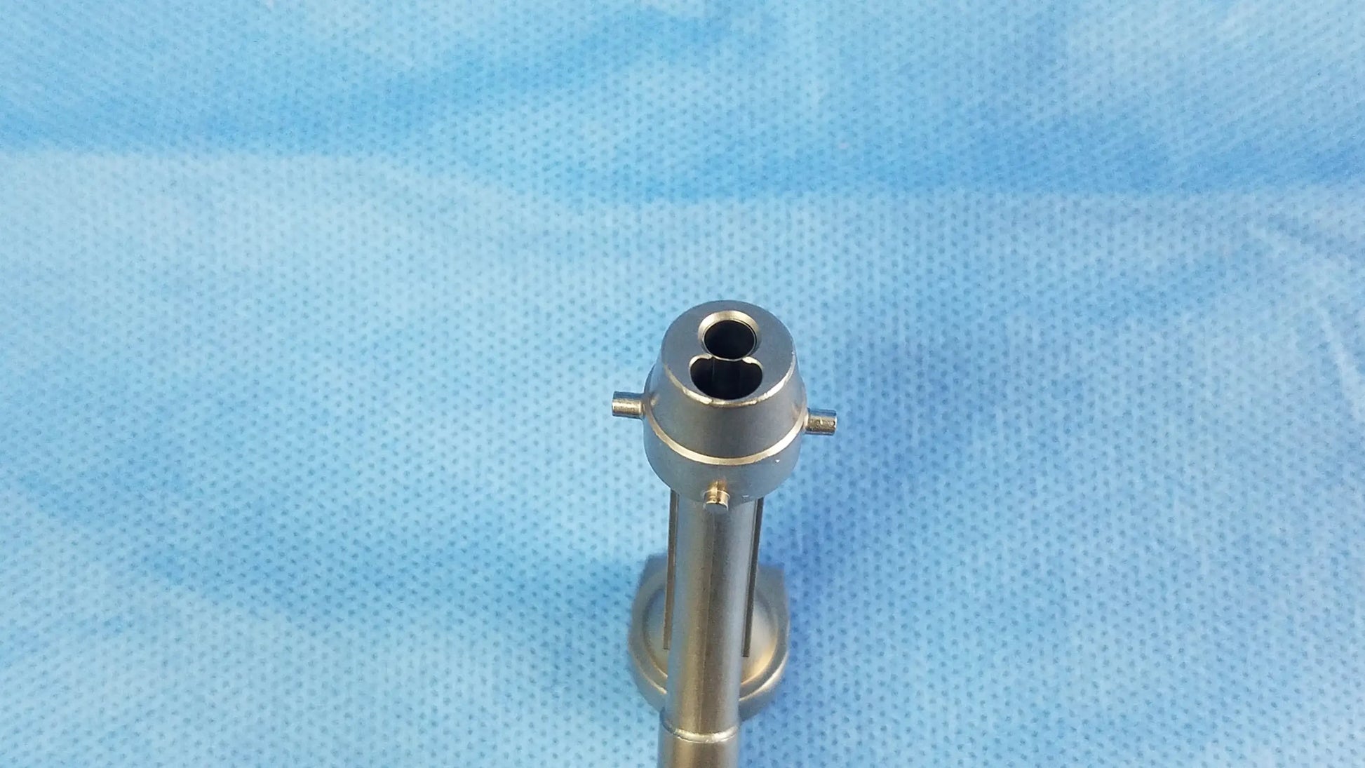 Silver surgical telescope cysto bridge with cylindrical shaft and dual channel circular head compatible olympus A20977A