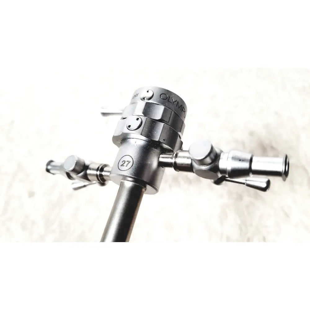 Silver metallic olympus a2181 endoscope sheath with engraved branding and three articulated arms model 27fr