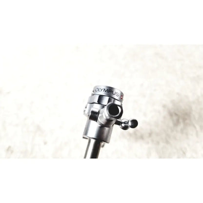 Silver metallic olympus a2181 endoscope sheath tripod head with matte finish and engraved branding for precise use