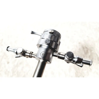 Silver metallic olympus a2181 endoscope sheath with engraved germany branding and three articulated arms design