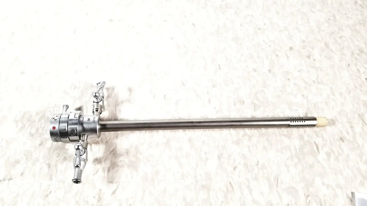 Silver surgical olympus a2181 endoscope with long slender metallic shaft and articulated control knobs at the handle