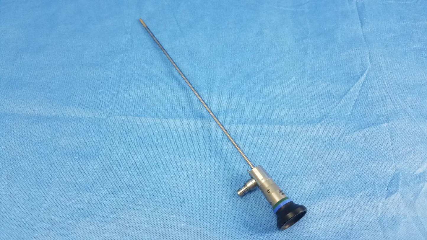Silver surgical endoscope with black rubber grip and brass joints compatible with olympus cystoscopic a22000a system