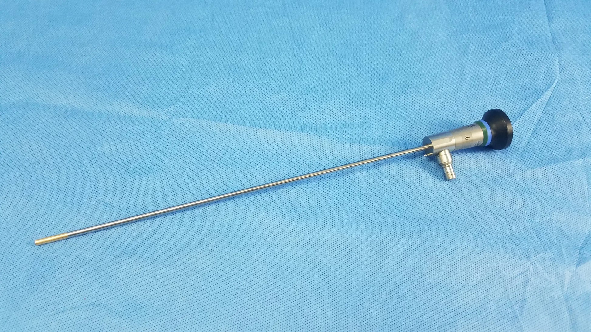 Silver surgical endoscope with black-tipped lens and metallic joints compatible with Olympus cystoscopic systems a22000a