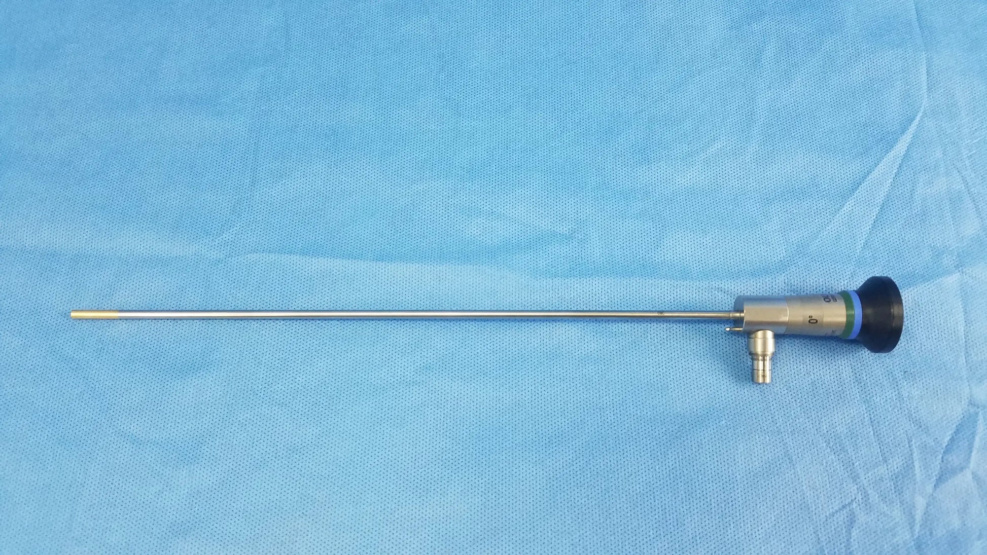 Silver surgical endoscope with black tip and metallic joints compatible with Olympus cystoscopic systems a22000a model