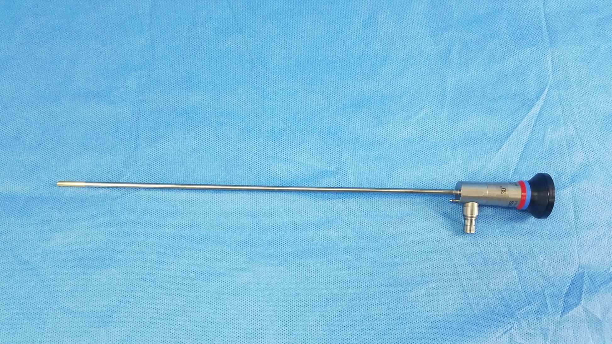 Silver surgical endoscope with black and red capped tip compatible with olympus cystoscopic systems a22002a model
