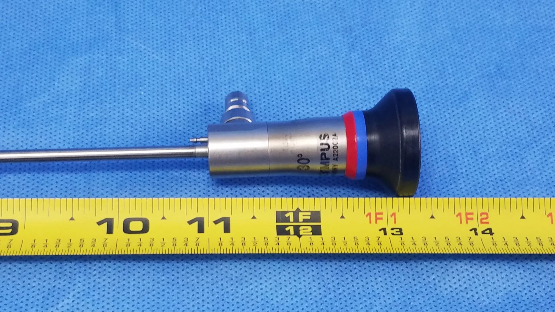 Silver metallic olympus a22002a 30° autoclave compatible cystoscopic endoscope with black red and blue rubberized tip