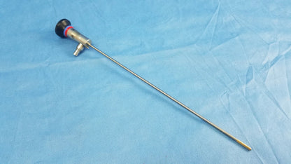 Silver surgical endoscope with black and red handle and long metallic shaft compatible with Olympus cystoscopic A22002A systems