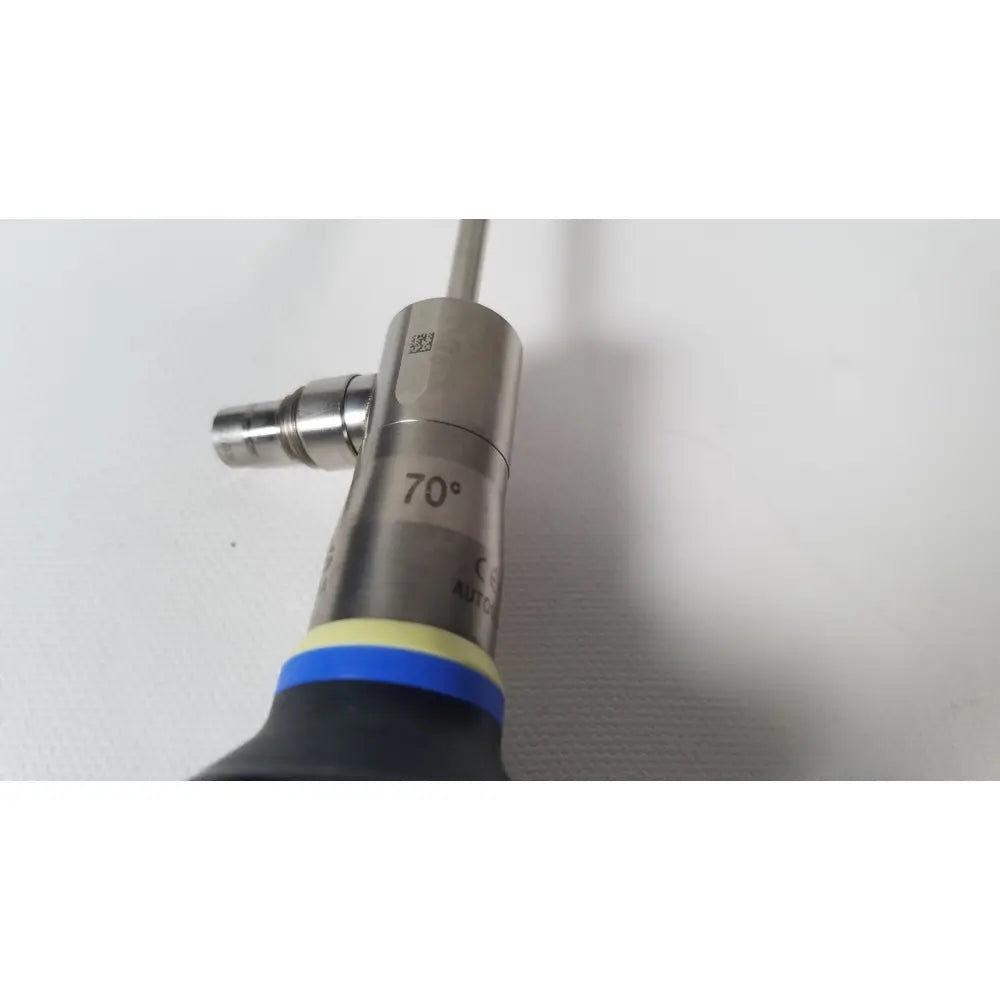 Silver metallic surgical instrument with 70-degree angled tip and blue-yellow grip olympus a22003a 4mm scope