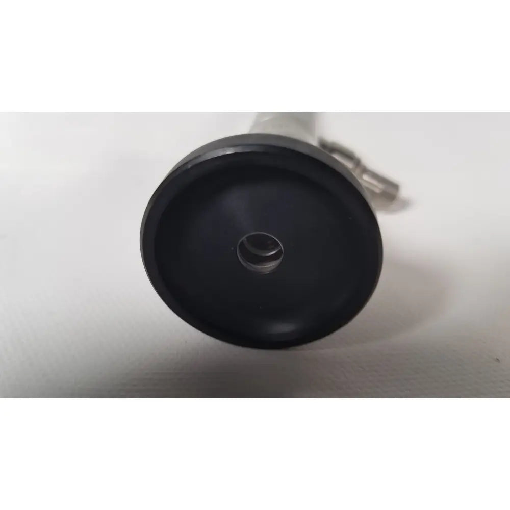 Black rubberized base with central hole and metallic connector of olympus a22003a 4mm 70 degree scope back view