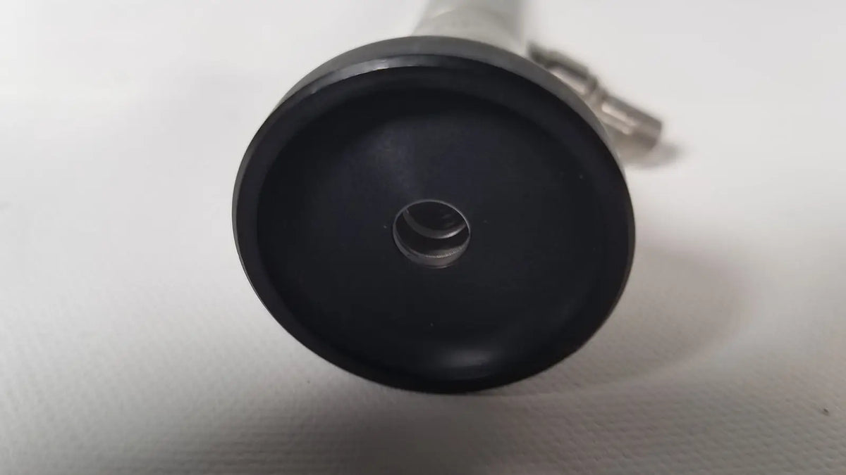 Black rubberized base with central hole and metallic connector of olympus a22003a 4mm 70 degree scope back view