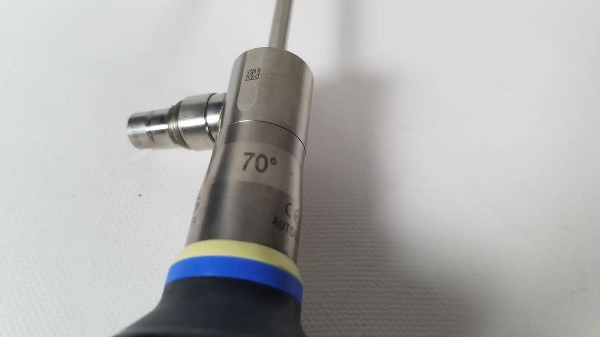 Silver metallic surgical instrument with 70-degree angled tip and blue-yellow grip olympus a22003a 4mm scope