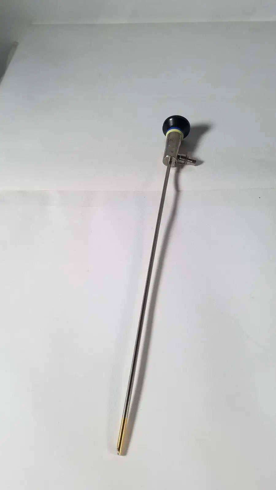 A sleek metallic endoscope with a black-tipped handle and reflective shaft olympus a22003a 4mm 70 degree scope