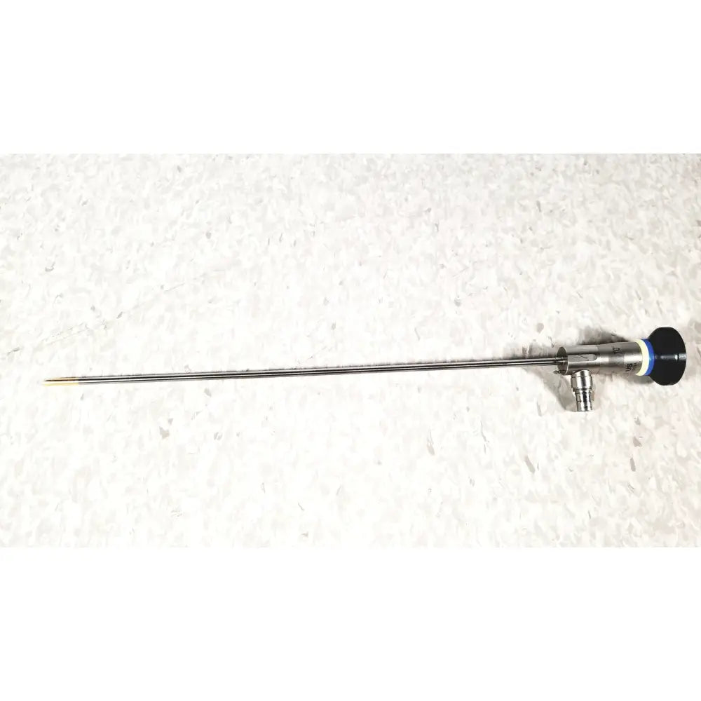 Silver surgical instrument with slender metallic shaft black handle and blue accent ring olympus a22003a 4mm cysttoscope