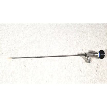 Silver surgical instrument with slender metallic shaft black handle and blue accent ring olympus a22003a 4mm cysttoscope