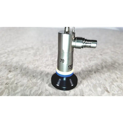 Silver and black olympus a22003a 4mm autoclavable cystoscope with blue ring marked 70 and oly german for medical use
