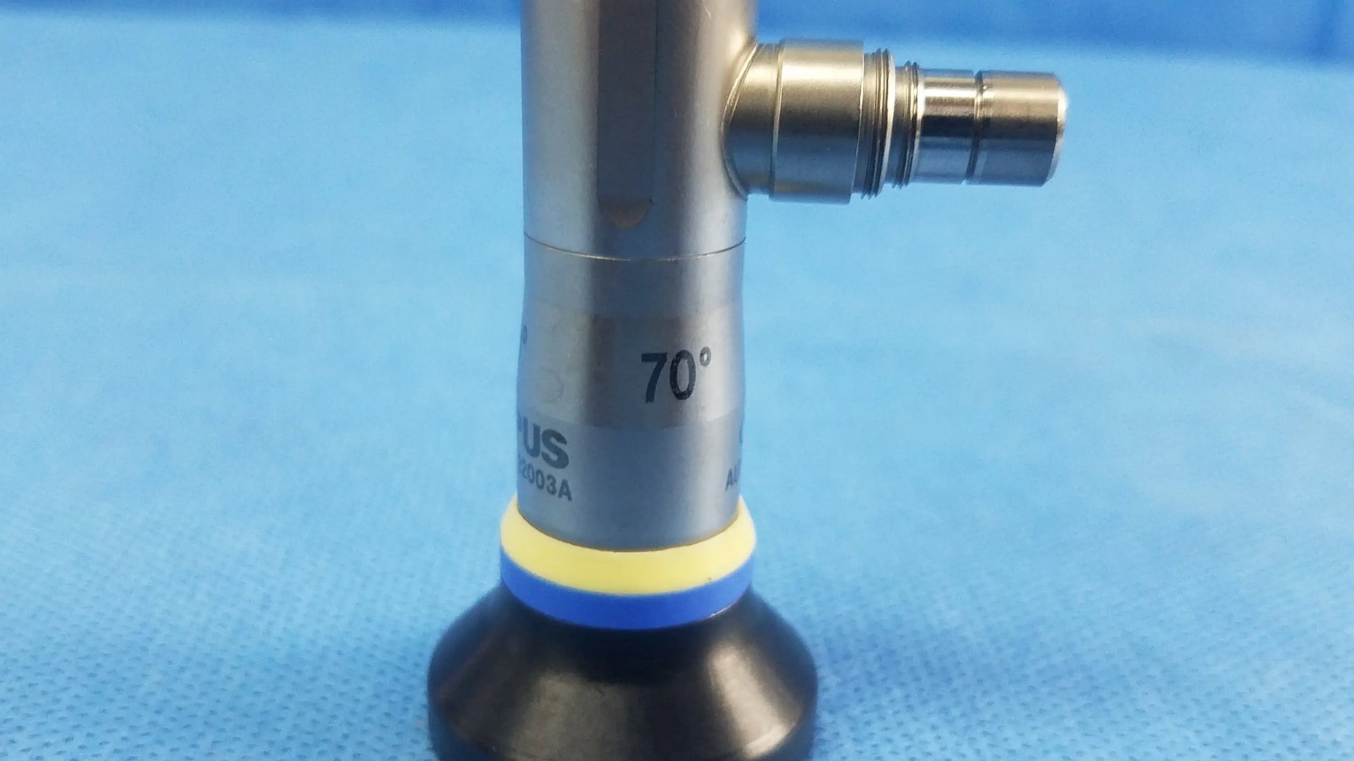 Silver rigid scope with 70 degree angled tip engraved markings black base ring with yellow and blue bands compatible olympus endoscopic systems
