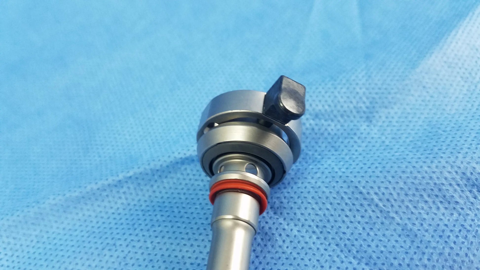 Silver olympus a22042a resection sheath with black adjustment knob and red o-ring endoscopic instrument component