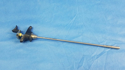 Silver surgical visual optical obturator with black ergonomic handle and yellow accent featuring long metallic shaft