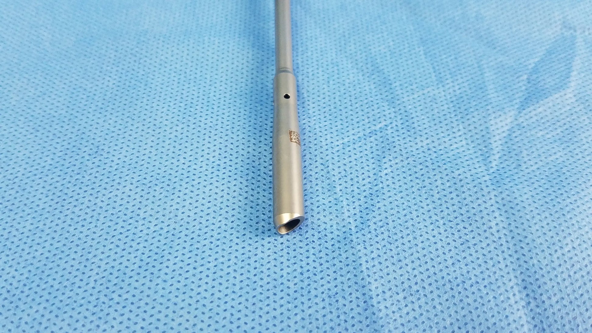 A sleek metallic olympus a22071a visual optical obturator with cylindrical body and flared tip in silver finish