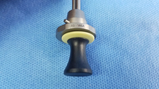 Black ergonomic handle with metallic silver collar and yellow rubber ring engraved a2 085a for compatible Olympus deflecting obturator instrument component