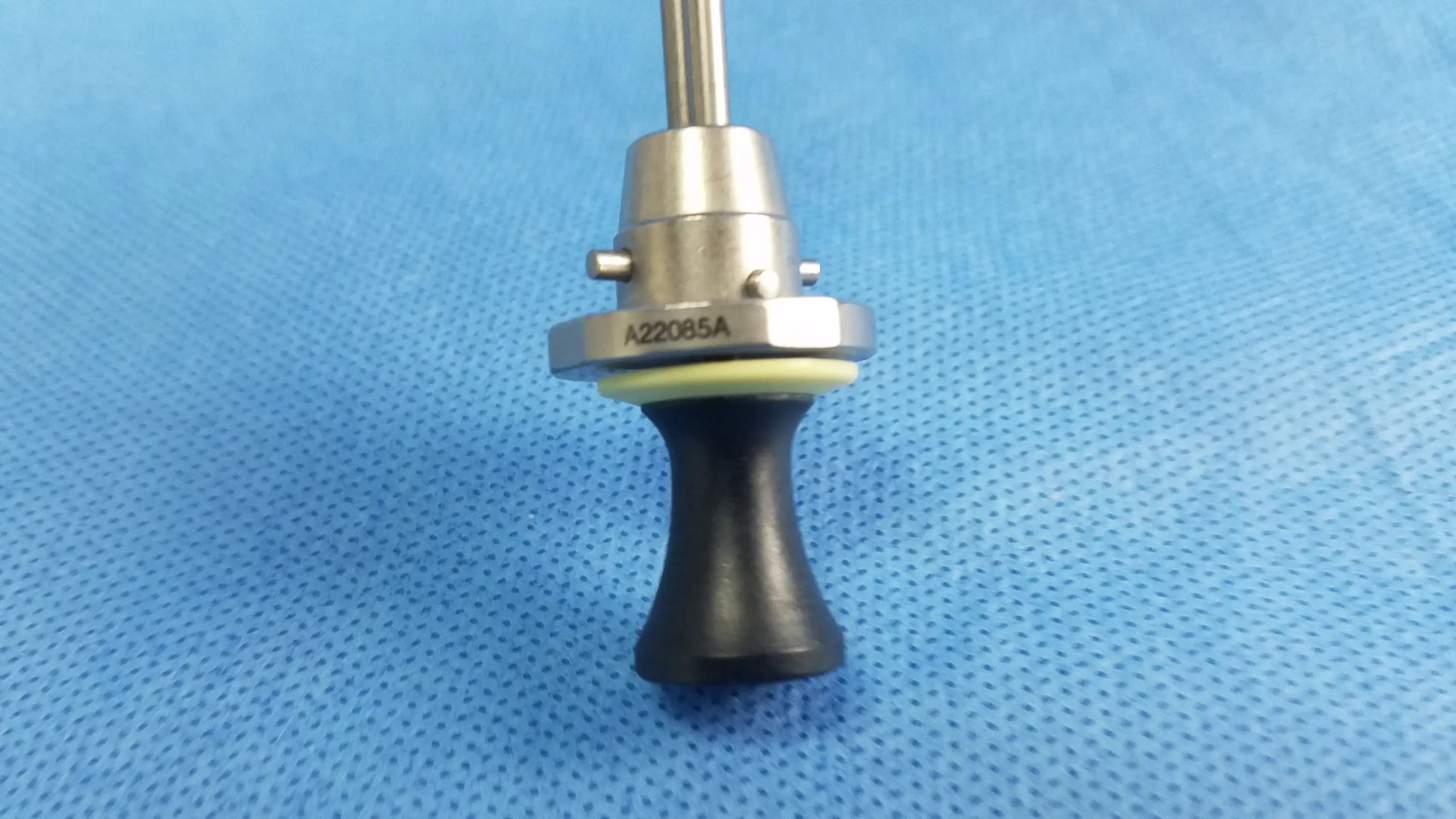 Silver deflecting obturator instrument component with black rubber grip and engraved model a22085a compatible olympus