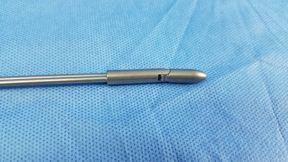 Silver deflecting obturator instrument component with a sleek metallic finish and tapered tip compatible with Olympus A22085A