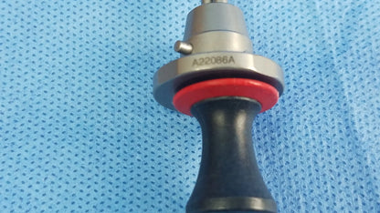 Silver surgical instrument with red rubber seal and black handle marked a22086a compatible olympus deflecting obturator