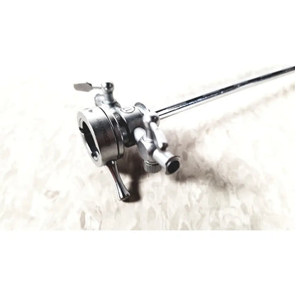 Silver surgical instrument with long slender shaft and articulated joints in olympus a2211 dual valve sheath 17 fr instrument