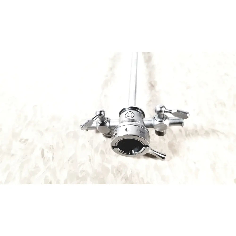 Silver stainless steel olympus a2211 dual valve sheath with central shaft and engraved branding surgical instrument