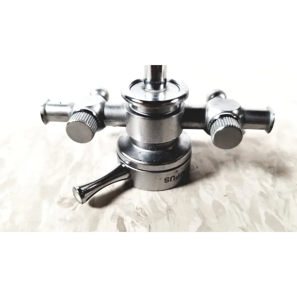 Silver metallic shower faucet with two handles and central spout featuring engraved branding for olympus a2211 dual valve sheath