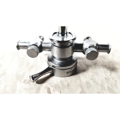 Silver metallic shower faucet with two handles and central spout featuring engraved branding for olympus a2211 dual valve sheath