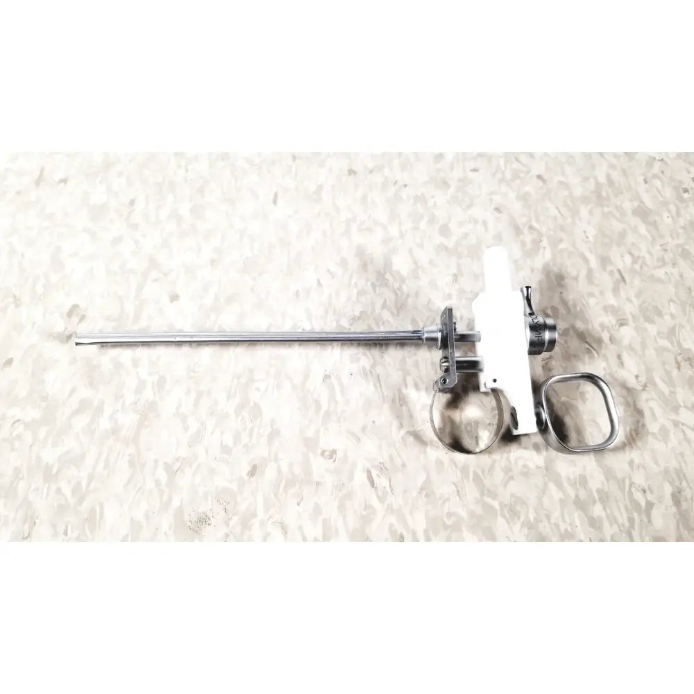 White and metallic olympus a3176 laparoscopic pediatric iglesias instrument with slender shaft and ring handle grip