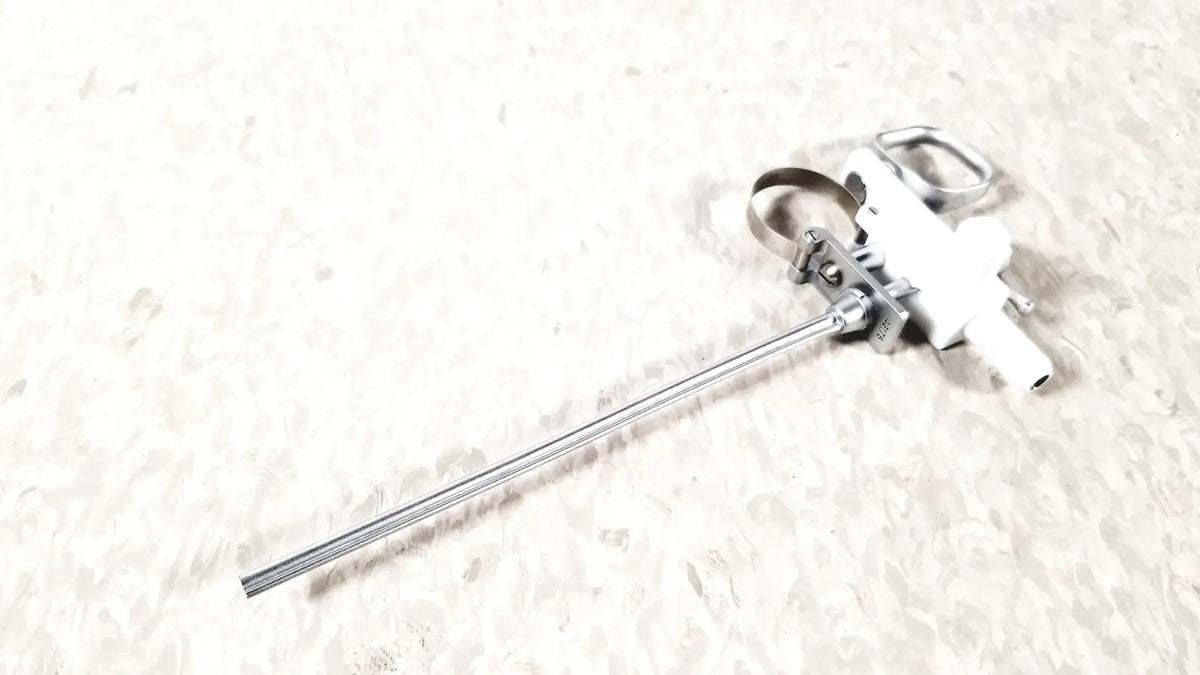 Silver metallic olympus a3176 laparoscopic pediatric iglesias endoscope with white plastic handle and metal clamps