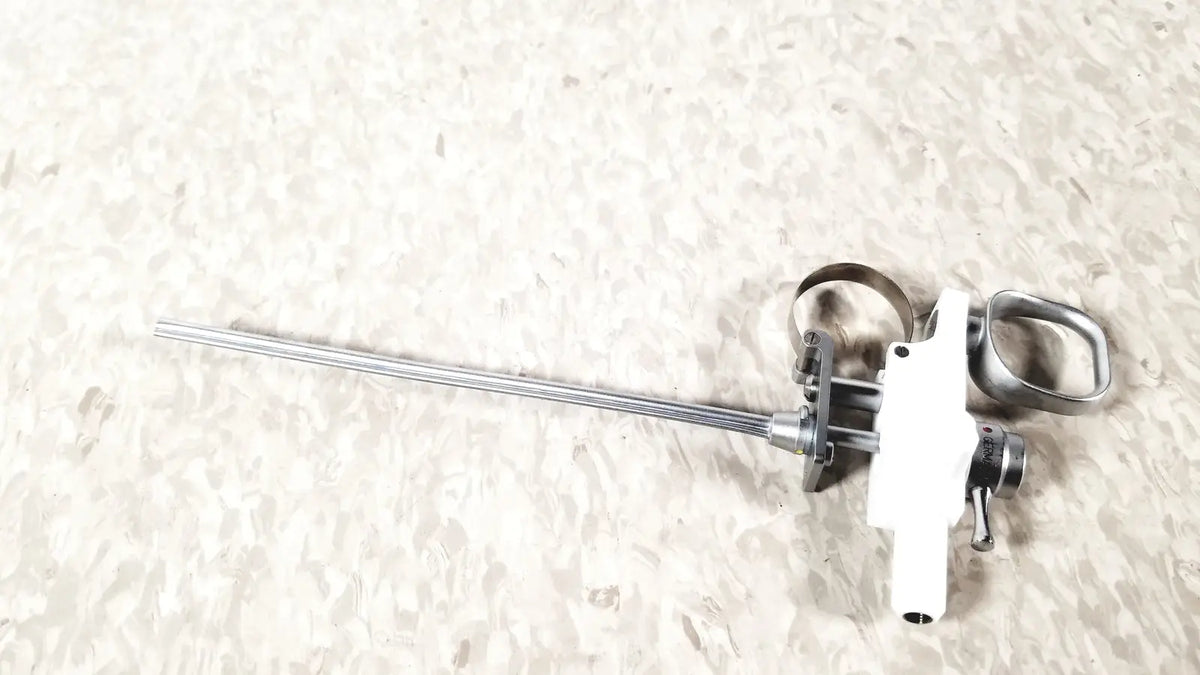 Silver and white Olympus A3176 laparoscopic pediatric Iglesias instrument with slender metallic shaft and ergonomic handle