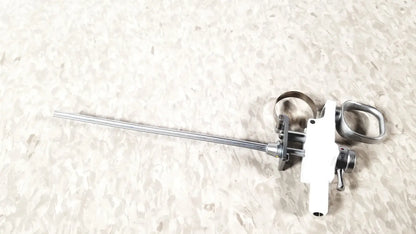 Silver and white Olympus A3176 laparoscopic pediatric Iglesias instrument with slender metallic shaft and ergonomic handle
