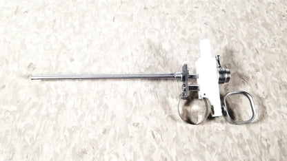 White and metallic olympus a3176 laparoscopic pediatric iglesias instrument with slender shaft and ring handle grip