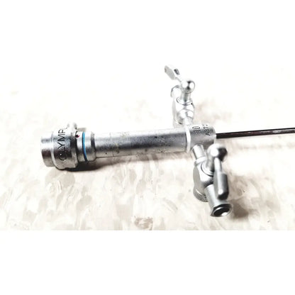 Silver metallic olympus a3721 pediatric endoscope with dual control knobs and black flexible tube for medical use