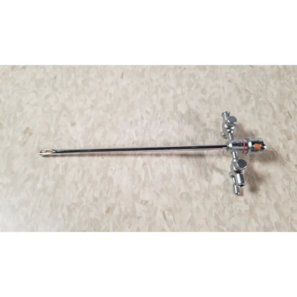 Silver-colored olympus a3722 pediatric sheath instrument with long slender shaft and complex control handle with knobs