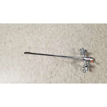 Silver-colored olympus a3722 pediatric sheath instrument with long slender shaft and articulated jointed end for medical use