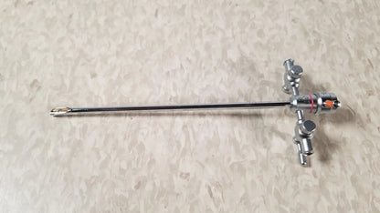 Silver-colored olympus a3722 pediatric sheath instrument with long slender shaft and complex control handle with knobs