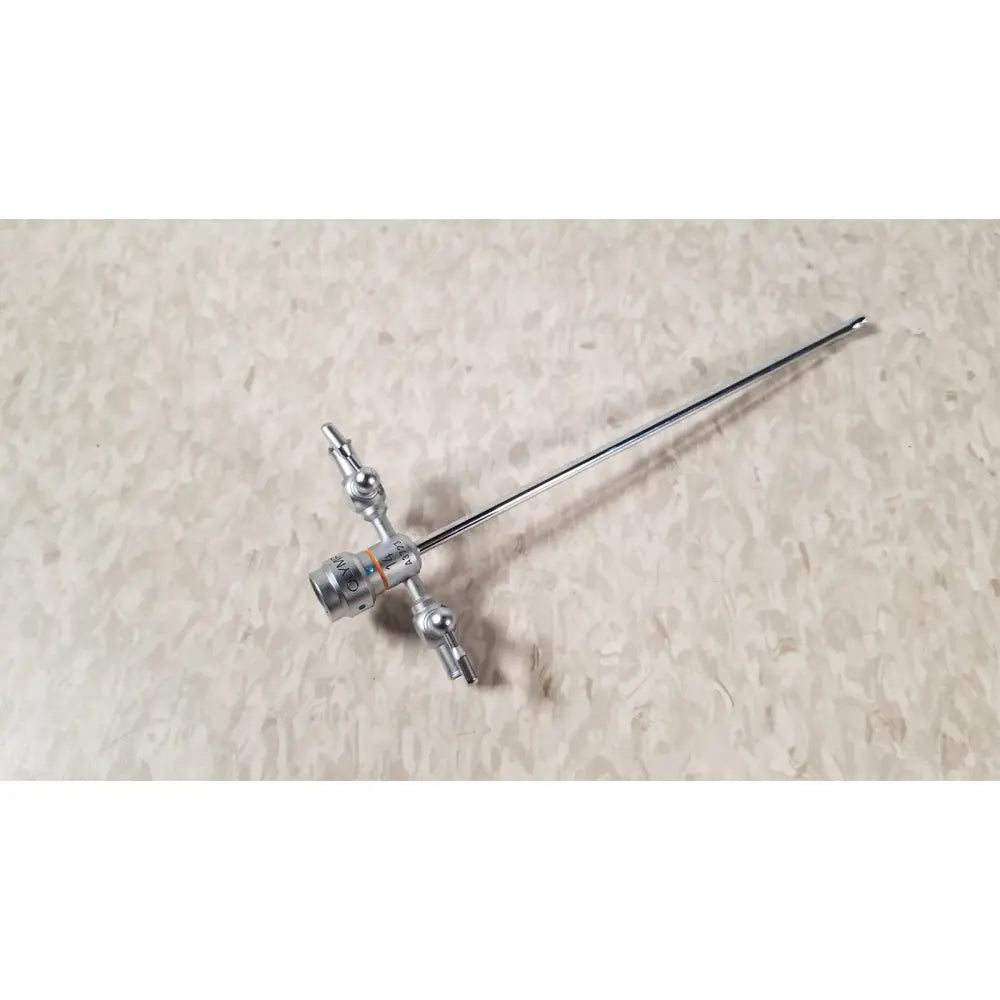Silver-colored surgical endoscope with long metallic shaft and articulated joints in olympus a3723 pediatric sheath 14 fr instrument