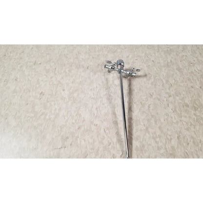 Silver-colored metal faucet with two handles and long spout shown alongside olympus a3723 pediatric sheath 14 fr instrument