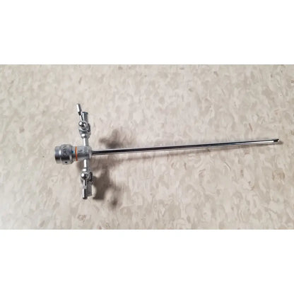 Silver surgical instrument with long slender shaft and complex knobbed handle for olympus a3723 pediatric sheath use