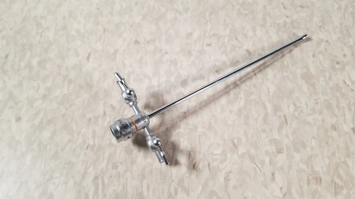 Silver-colored surgical endoscope with long metallic shaft and articulated joints in olympus a3723 pediatric sheath 14 fr instrument