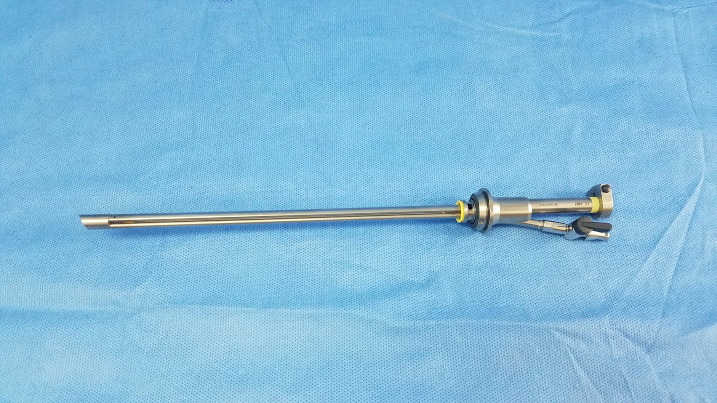 Silver metallic working insert a42091a with long slender shaft and articulated jointed end in sterilization tray